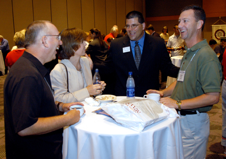 Senior Vice President for University Relations Charles Fowler (center) enjoys a light moment with a few friends at the SBC Alumni and Friends Dessert Reception.  Pictured from left to right: Dr. Jerry Winfield, Carolyn Priest, Dr. Fowler and Dr. Mike Priest. - Photo by Jim Veneman