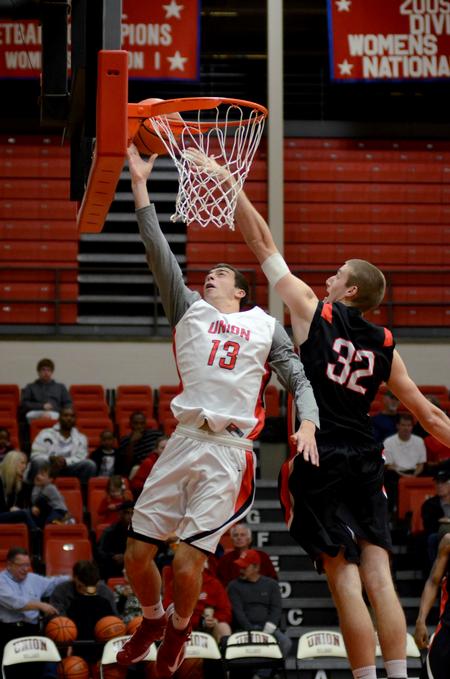 Giorgi Koguashvili goes up for a shot against Eric Leisey during a scrimmage game at Bulldog Madness. - Photo by Jacob Moore