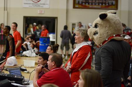 Lanese Dockery, first lady of the university, and Buster the Bulldog watch the festivities of Bulldog Madness, which was held in the Fred DeLay Gymnasium. - Photo by Jacob Moore