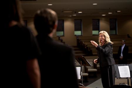 Dian Eddleman, USJ Choral Director, conducts a joint choir with members from Union University Singers and University School of Jackson. - Photo by Ryan Oetting