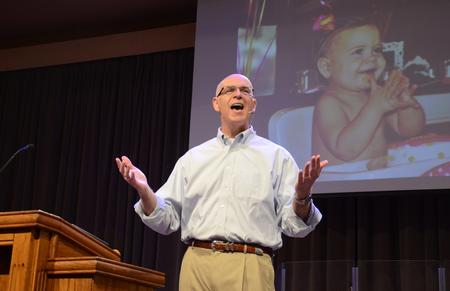 Larry York, pastor of Crossroads Baptist Church in Woodlands, Texas, shares a photo of his granddaughter as introduction to his talk in chapel. - Photo by Jacob Moore