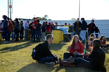 Matthew Young, Rachel Etherington, Hannah Durham and Weatherly Russell enjoy the pre-game tailgate celebrating Senior Night for the soccer teams.  - Photo by Anne Richoux