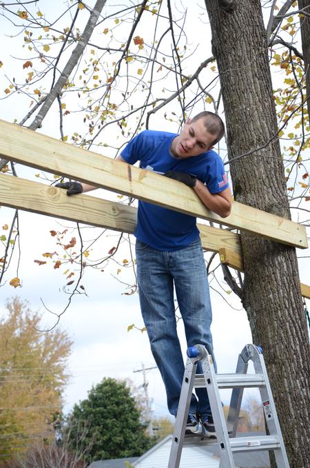Dylan Baker, junior engineering major, works on building a swing set for the East Chester site of Mission Jackson, an outreach program of Englewood Baptist Church, during Campus and Community Day.  - Photo by Anne Richoux