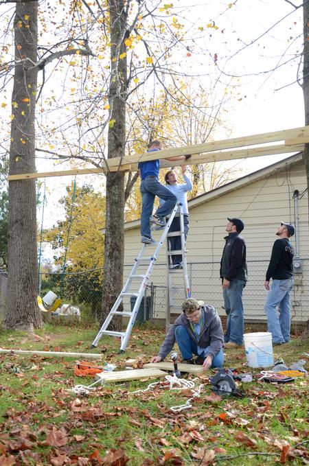 Engineering students work on building a swing set for the East Chester site of Mission Jackson, an outreach program of Englewood Baptist Church, during the tenth annual Campus and Community Day.  - Photo by Anne Richoux