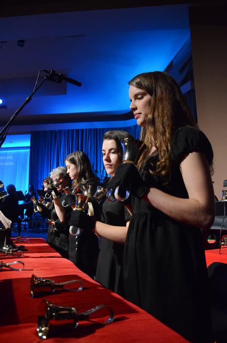 The handbell choir performs "Sussex Carol" in the chapel during "A Union Christmas." - Photo by Zac Calvert