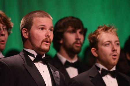 Russ Parrish, junior theology major, sings with the choir in the chapel during "A Union Christmas." - Photo by Zac Calvert