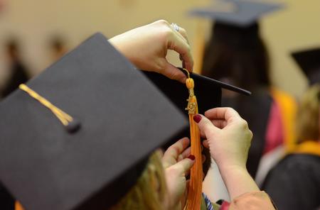 Graduates adjust their tassels before Fall Commencement held at West Jackson Baptist Church. - Photo by Jacob Moore