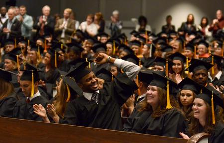 Students cheer at the conclusion of Fall Commencement. - Photo by Jacob Moore