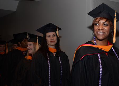 Quaneshia Farris, master of science in nursing, smiles at friends during the procession into the sanctuary at West Jackson Baptist Church during Fall Commencement. - Photo by Zac Calvert
