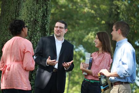 Keith Bates, associate professor of history, chats with some of his students in the Grove. - Photo by Kristi McMurry Woody