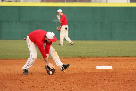 Cole McAdams, senior physical education & health major, fields a ground ball during practice.
 - Photo by Matt McDaniel