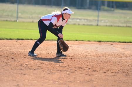 Whitney Christian watches intently as a Bethel University player bats during a double-header. - Photo by Anne Richoux