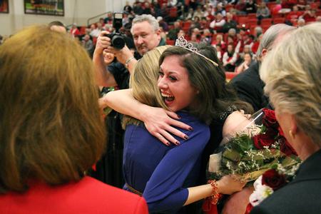 Hannah Strickland hugs Andi Schreiber, 2012 homecoming queen, after being named the 2013 homecoming queen. - Photo by Matt McDaniel