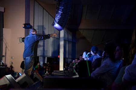 Comedian Bone Hampton gets the crowd excited for the homecoming chapel, which also included Propaganda, Dee-1, and LeCrae. - Photo by Anne Richoux