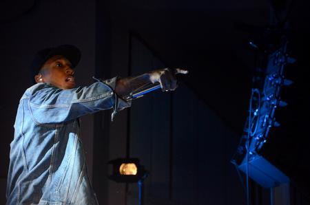 Grammy award winner LeCrae motions toward the crowd to encourage them to sing along during the Homecoming concert. - Photo by Anne Richoux