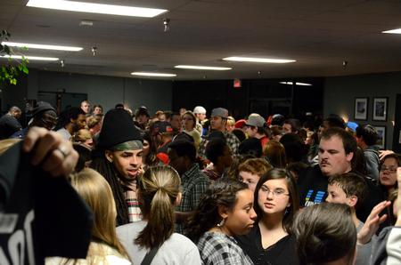 Students and guests fill the lobby, waiting to talk to hip hop artist Dee-1 and other performers after the Homecoming concert. - Photo by Anne Richoux