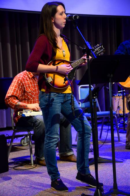 Anna Beard, junior advertising major and photojournalism minor, plays the mandolin and sings in chapel with Christ Community Church's worship band. - Photo by Olivia Wallace