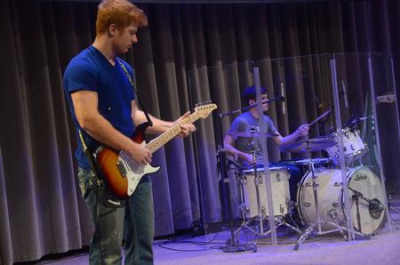 Ben Wilson, guitarist for The Brett Perkins Band, and Joey Davis, junior marketing major and drummer for The Brett Perkins Band, lead music in chapel. - Photo by Matt McDaniel