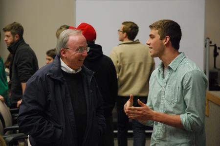 David S. Dockery, president of the university, talks and laughs with freshman Jesse Dahms prior to Student Senate. - Photo by Anne Richoux