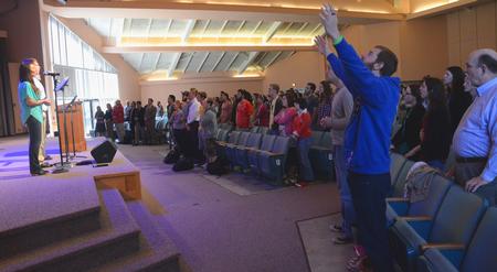 Students, faculty and staff praise the name of Jesus together during chapel. - Photo by Olivia Wallace