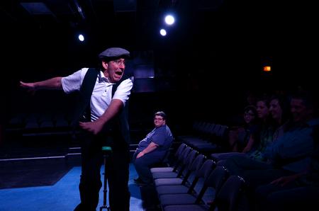 Guest artist Doug Berky performs for students and guests April 16 in the W.D. Powell Theatre.  - Photo by Anne Richoux