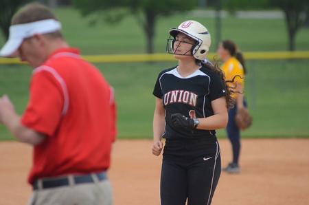 Summer Cross, freshman nursing major, jogs back to first base after a foul ball. - Photo by Matt McDaniel