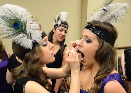 Members of Kappa Delta apply finishing touches to their 20s costumes before the 16th annual Variety Show. - Photo by Jacob Moore