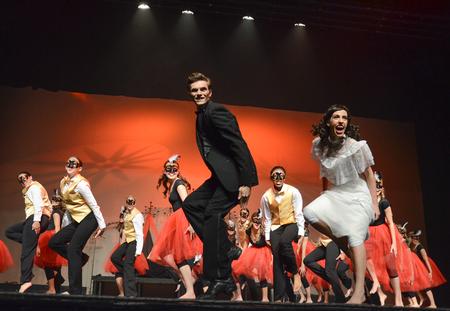 Nick Fleming, sophomore ministries and missions major, performs a masquerade scene from Zeta Tau Alpha's Variety Show performance with Tori Brooks, junior English creative writing major, and members of Zeta Tau Alpha. - Photo by Jacob Moore