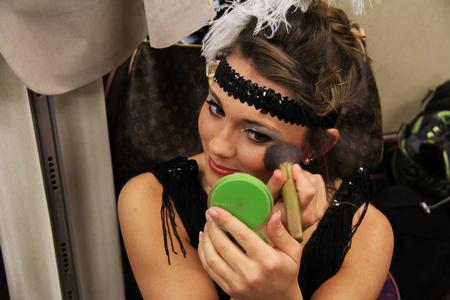 Lindsey Blackwood, senior media communications major, puts on her makeup before the Kappa Delta performance in the 16th annual Variety Show at the Carl Perkins Civic Center. - Photo by Matt McDaniel
