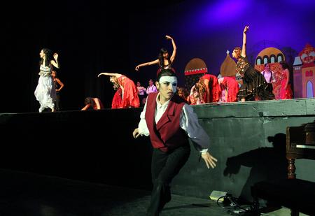 Claudia Velasco, senior philosophy major, plays the phantom in the Zeta Tau Alpha performance of "Phantom of the Opera" during the 16th annual Variety Show at the Carl Perkins Civic Center. - Photo by Matt McDaniel