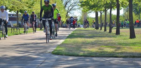 Riders in the inaugural Tour of Jackson bike ride take off from beside the bell tower. The event was spearheaded by Cliff Pawley, assistant professor of athletic training. - Photo by Olivia Wallace