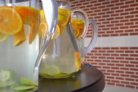 Water filled with orange and lime slices chills on a table outside of the Bowld Student Commons for the residence life event Cooking with Class.  - Photo by Olivia Wallace