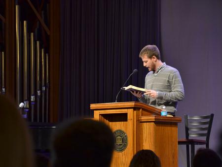 David Carothers, assistant director of student mobilization in the office of spiritual life, reads scripture during his message in chapel. - Photo by Olivia Wallace