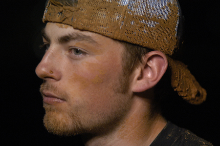 Junior Josh Howerton contemplates the dirtiness that has ensued during the Young Alum's Midnight Mudness. - Photo by Jonathan Blair
