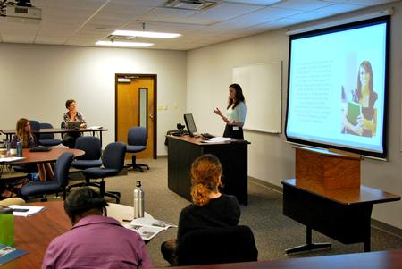 Courtney Rankin, senior sociology major, presents her research project during the Scholarship Symposium. - Photo by Anne Richoux