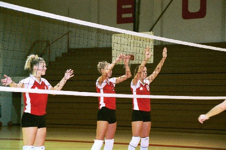 No. 4 Lindsay Stahlberg (left), No 5 Andrea Darr (middle), and No. 8 Jennie Glassey (right) are ready to block any shot that comes their way - Photo by Tommy Sadler