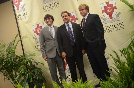 Matt Street, senior business administration major, and Colby Benefield, junior history major, get their picture with Nick Saban, head football coach at the University of Alabama, at the Roy L. White Legacy Golf and Gala held at the Carl Perkins Civic Center. - Photo by Matt McDaniel
