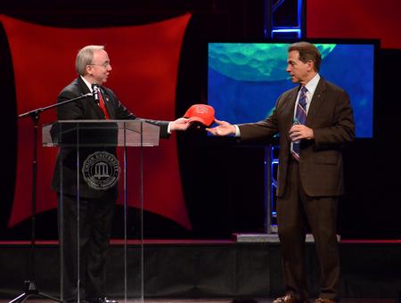 David S. Dockery, president of the university, gives an honorary Union Bulldog ball cap to Nick Saban, head football coach at the University of Alabama, who was the keynote speaker at the fifth annual Roy L. White Legacy Golf and Gala. - Photo by Jacob Moore