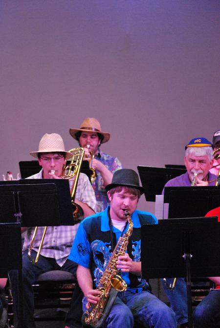 Blake Giles (center), junior music major, performs during the jazz band concert.  - Photo by Anne Richoux