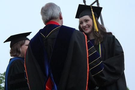 Rachel Carbonell, engineering graduate, accepts the Tigrett Medal from David S. Dockery, president of the university. - Photo by Matt McDaniel