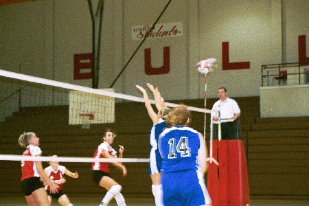 No. 8 Jennie Glassey (junior from Carlsbad, CA) goes for the kill.  Andrea Darr and Allison Shein look on. - Photo by Tommy Sadler