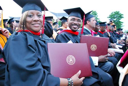 Master of Christian studies graduates, Debra Burroughs and Zedric Clayton, smile after receiving diplomas at Spring Graduation. - Photo by Anne Richoux