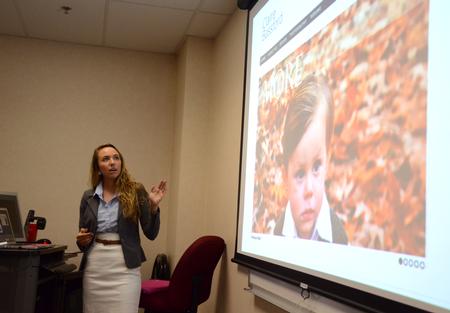Claire Bassford, senior digital media studies major, presents on her experimentation with creating a responsive website during the 10th annual Scholarship Symposium. - Photo by Jacob Moore