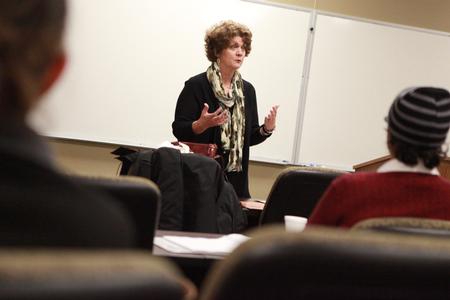 Luanne Powell, director of the McAfee School of Business Administration, teaches a night class in the MBA program.  - Photo by Kristi McMurry Woody