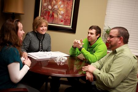 Beverly Absher, chair of the department of continuing studies, talks with students in her office at the Center for Continuing and Professional Studies.  - Photo by Kristi McMurry Woody