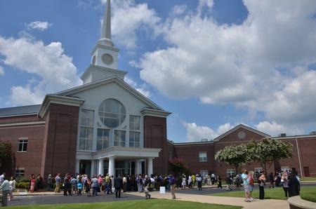JACKSON, Tenn. – July 27, 2013– Nearly 200 students graduated from Union University July 27, during the summer commencement service of the 188th graduating class at West Jackson Baptist Church.  Graduates and family leave West Jackson Baptist church after the summer commencement service. - Photo by Morris Abernathy