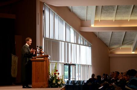 SGA President Caleb Valentine speaks to fellow students during Fall Convocation.  - Photo by Anne Richoux