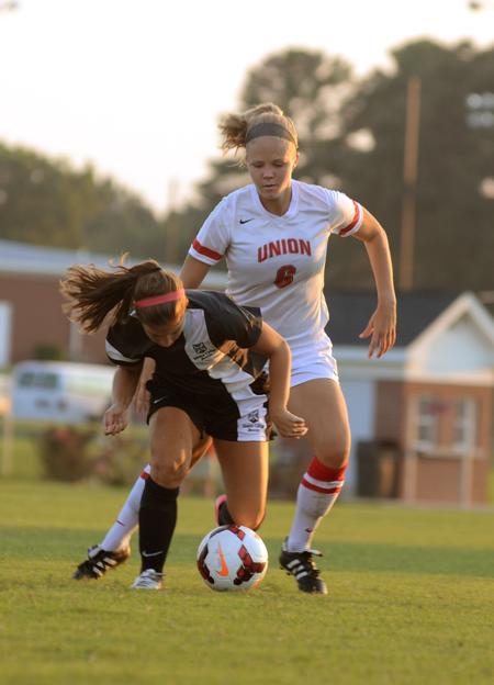 Lady Bulldog Alex Taylor fights for possession of the ball during the opening exhibition game against Rhodes College.  - Photo by Amanda Rohde