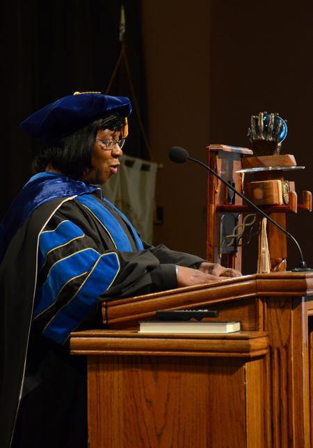 Rhonda Hudson, professor of social work and acting program director for BSW, leads the recitation of the Apostles' Creed during convocation. - Photo by Jacob Moore
