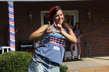 Jenna Ward, junior biology major, shows off her Kappa Delta pride during  bid day. - Photo by Matt McDaniel